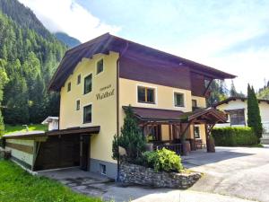a hotel with a building in the mountains at Holiday Home Waldhof by Interhome in Im Brand