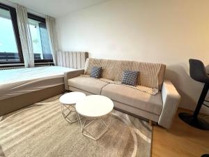 a living room with a couch and a table at NaturTraum Kniebis in Freudenstadt