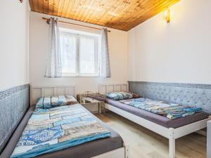 a bedroom with two beds and a window at Holiday Home Sunny by Interhome in Balatonőszöd