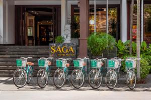 a row of bikes parked in front of a building at The Saga Hotel Hoi An in Hoi An