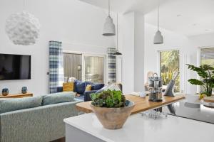 a living room with a couch and a table at No 1 The Vista, Willingcott, Woolacombe in Woolacombe