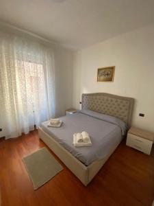 Ένα ή περισσότερα κρεβάτια σε δωμάτιο στο Casa Vacanze The Sunbeam