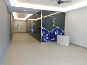 a hallway with a wall with a sign on it at Utropolis Glenmarie - Shah Alam in Shah Alam