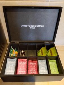 a box filled with different colored candles at Gite Le petit nid in Châteauneuf +11 photos