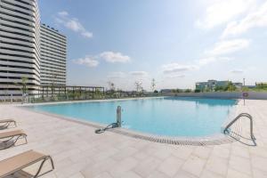 a large swimming pool on top of a building at Be Casa Alcobendas in Alcobendas