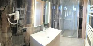 a bathroom with a sink and a mirror at Garden and Sea in Nikiti +15 photos