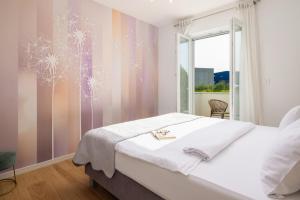 a bedroom with a bed with a snowflake wall mural at Villa Marijeta exclusive 5 star villa with 50sqm private pool, 6 bedrooms and playroom in Split +50 photos