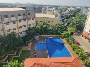 an overhead view of a swimming pool in a city at not applicable! in Kaikalapettai