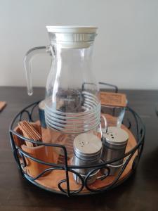 a wire basket with a glass jar on a table at not applicable! in Kaikalapettai