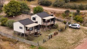 an aerial view of a house and a car at Ocean Paradise 1 in Punta Del Diablo