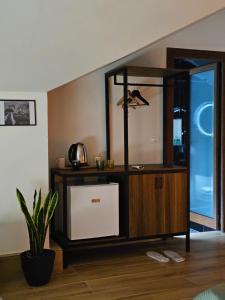 a room with a large wooden cabinet with a window at Lemon Garden in Gjirokastër