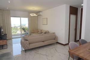 a living room with a couch and a table at Belvedere at Emerald Residence Bar in Bar