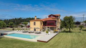 an aerial view of a house with a swimming pool at Villa 326 in Esposende