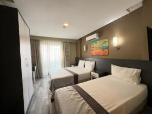 Katil atau katil-katil dalam bilik di Bone Apart Otel