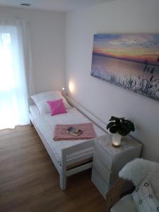 Ένα ή περισσότερα κρεβάτια σε δωμάτιο στο Sandifin Appartement