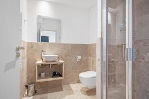 a bathroom with a toilet and a sink and a shower at Château Hermitage de Combas in Servian +117 photos