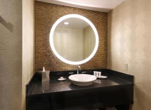 a bathroom with a sink and a mirror on the wall at Hotel Angeleno in Los Angeles