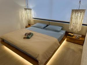 a bedroom with a bed with a camera on it at Dreamland View Villa #3 with Pool in Uluwatu +63 photos