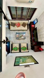 a room with two chairs and a table at Flower Homestay-Grand opening-VIP Homestay Local-Indochic-4Bedrooms in Hanoi