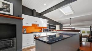 a large kitchen with a large island in the middle at Kedumba Cottage: Gorgeous Home 2 Min Walk to Town in Katoomba