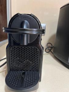 a black blender sitting on a counter next to a computer at Cal Graell in Oliana +13 photos