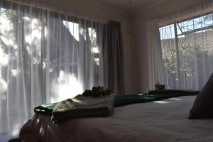 Ένα ή περισσότερα κρεβάτια σε δωμάτιο στο Feet Up at 25