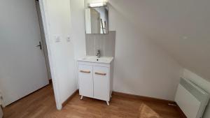 a white bathroom with a sink and a mirror at Duplex pour groupe au centre d'Azay Le Rideau in Azay-le-Rideau +33 photos