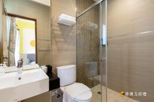 a bathroom with a toilet and a sink and a shower at 家家嵐玥 in Toucheng +40 photos