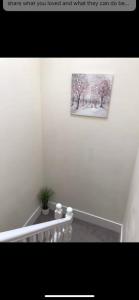 a room with a picture of trees on the wall at 34 - Room 5 - Uplands in Swansea +1 photo