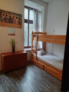 a room with two bunk beds and a window at Room Hostel Piotrkowska in Łódź +13 photos