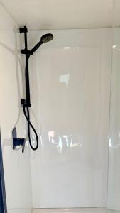 a crucifix hanging on a wall in a bathroom at Grace & Rose in Gibbston +21 photos