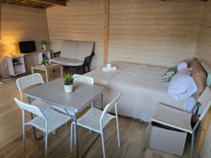 En eller flere senge i et værelse på Cabin-holiday