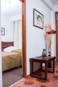 Giường trong phòng chung tại Hotel & Bungalows Villa Valencia