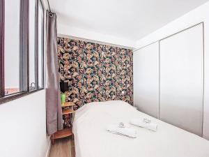 Ένα ή περισσότερα κρεβάτια σε δωμάτιο στο Apartment L'étoile de la mer by Interhome