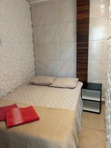 a bedroom with two twin beds in a room at Dunamis in São Gonçalo do Amarante +3 photos