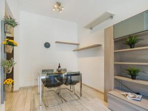 a dining room with a glass table and chairs at Apartment Appartamento Lara by Interhome in Lido di Camaiore