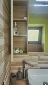 a bathroom with a sink and a toilet in it at La Torretta in Lanzo dʼIntelvi +22 photos