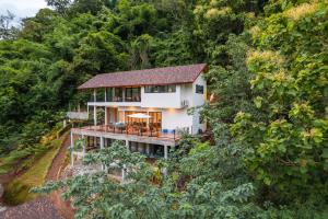 an aerial view of a house in the forest at Vianna Villas Chiangmai in Mae Rim