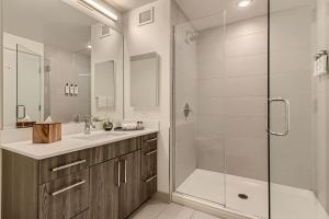 a bathroom with a shower and a sink and a tub at Sentral Michigan Avenue in Chicago +50 photos