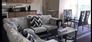 a living room with a couch and a table at 34 - Room 7 - Uplands in Swansea