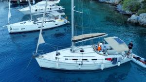 two boats are docked in a body of water at Nautical Nomads Yacht Charter in Tivat