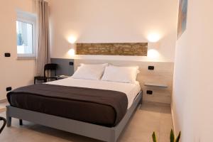 a bedroom with a large bed in a room at Miramare Suites in Vasto +36 photos