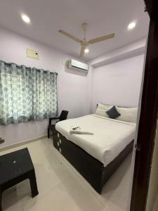 Ένα ή περισσότερα κρεβάτια σε δωμάτιο στο Hotel Udaan Villa