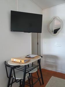 a table with a box on it in a room at Casa Bella Studio in São Brás de Alportel