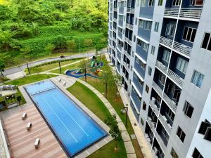 an overhead view of a swimming pool next to a building at Suria Pantai Residency Kuala Lumpur in Kuala Lumpur