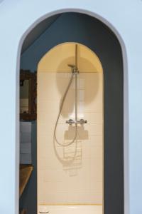 a shower in a bathroom with a tile wall at Authentieke schuur nabij Brugge in Beernem +29 photos