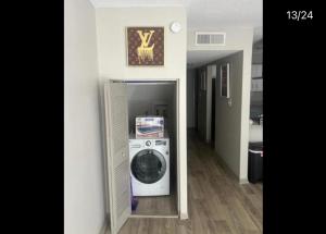 a washer and dryer in a hallway of a house at Quality stay in Birmingham