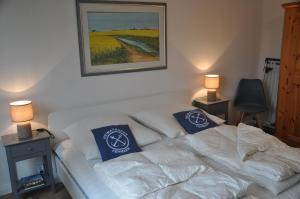 En eller flere senge i et værelse på Ostsee Huus 2