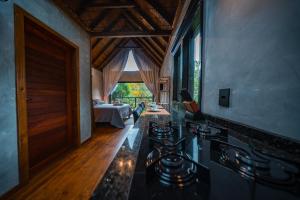 a living room with a couch and a table at Cabana Marabella in Santa Teresa