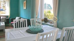 a dining room with a table with a bowl on it at blue lagoon in Fehmarn